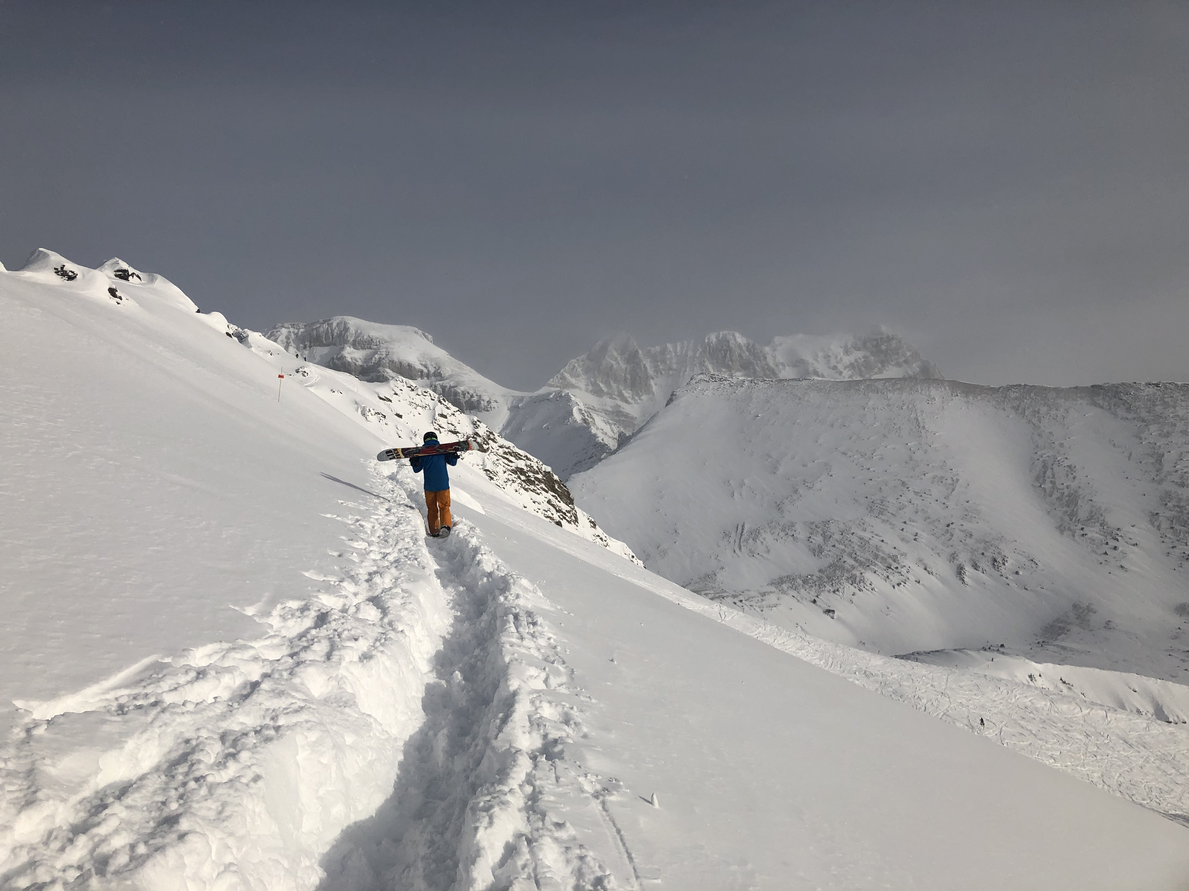 A view of a snowy mountain peak from the trail.