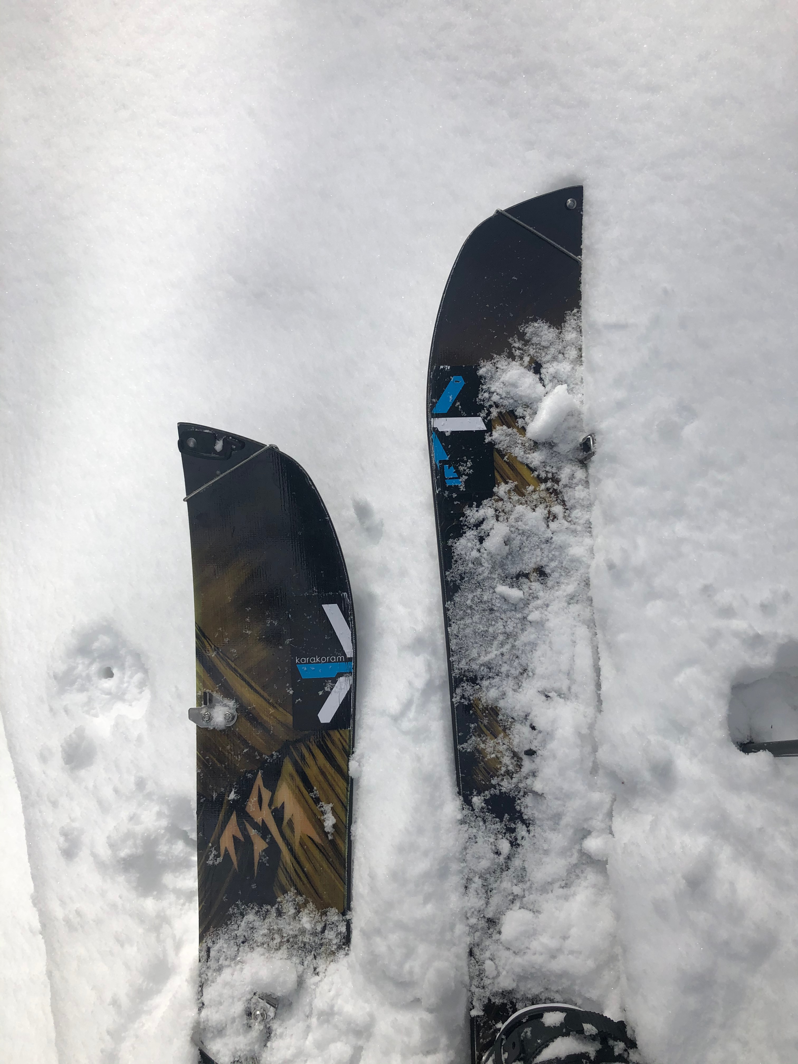 A person hiking up a steep, snowy mountain slope.