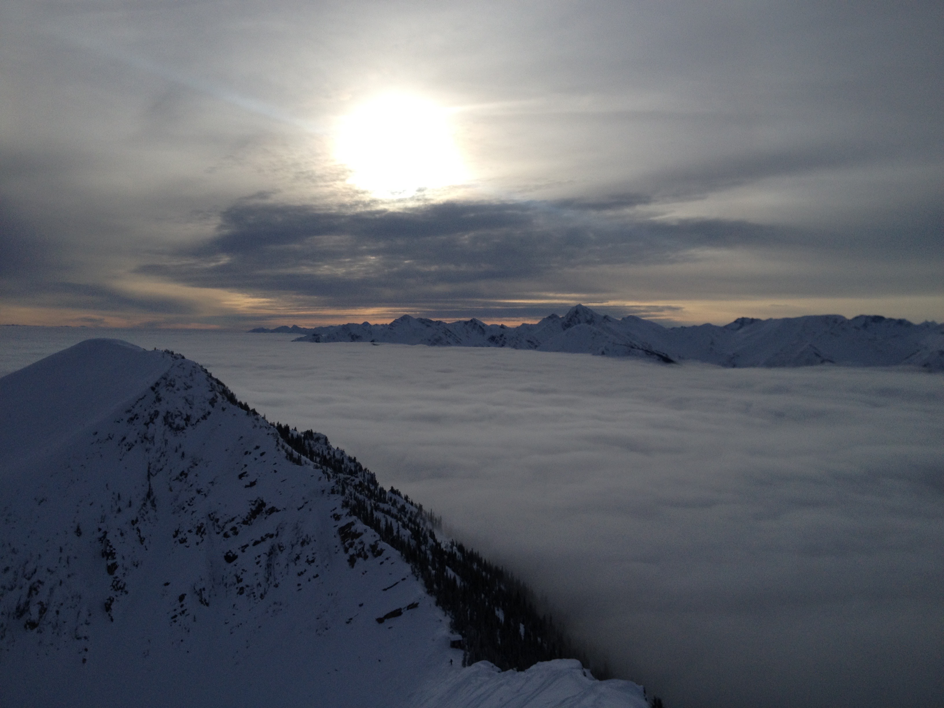 A snowboarder at the top of Terminator Ridge at Kickinghorse Mountain Resort.