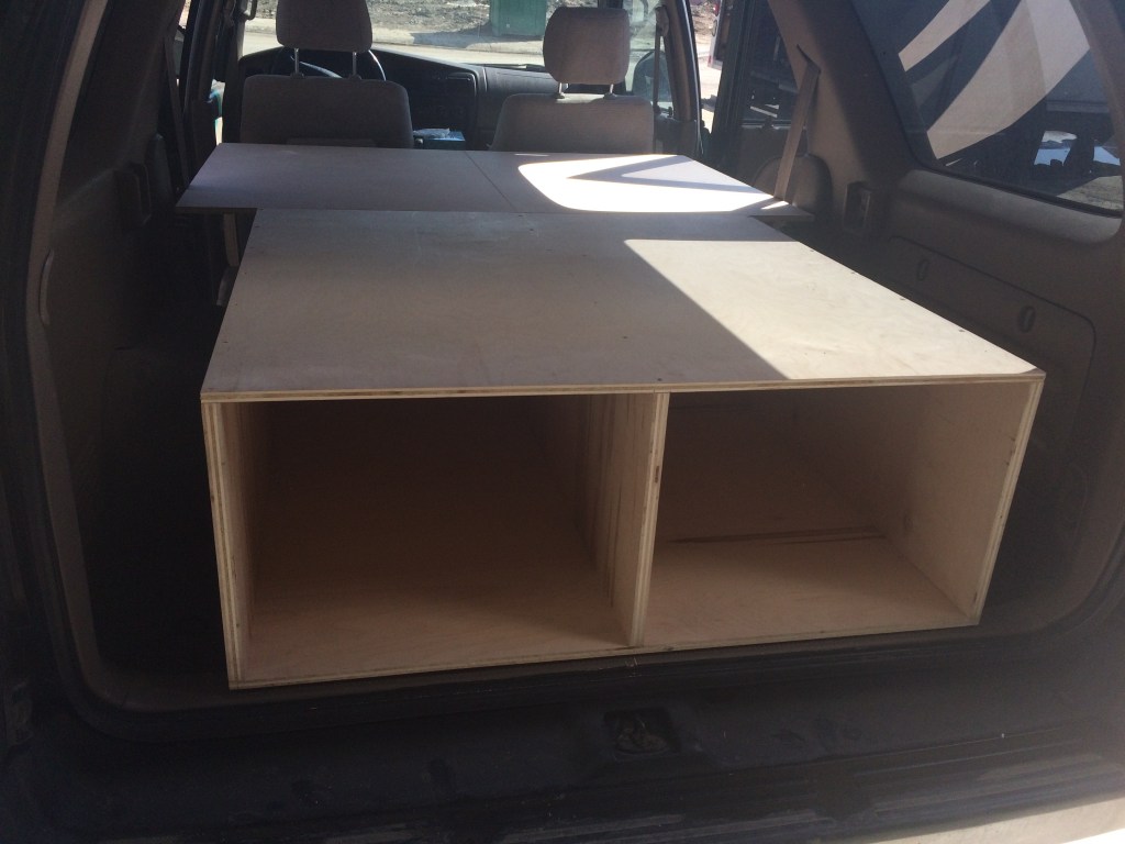 The platform showing drawer slots and extensions for sleeping.