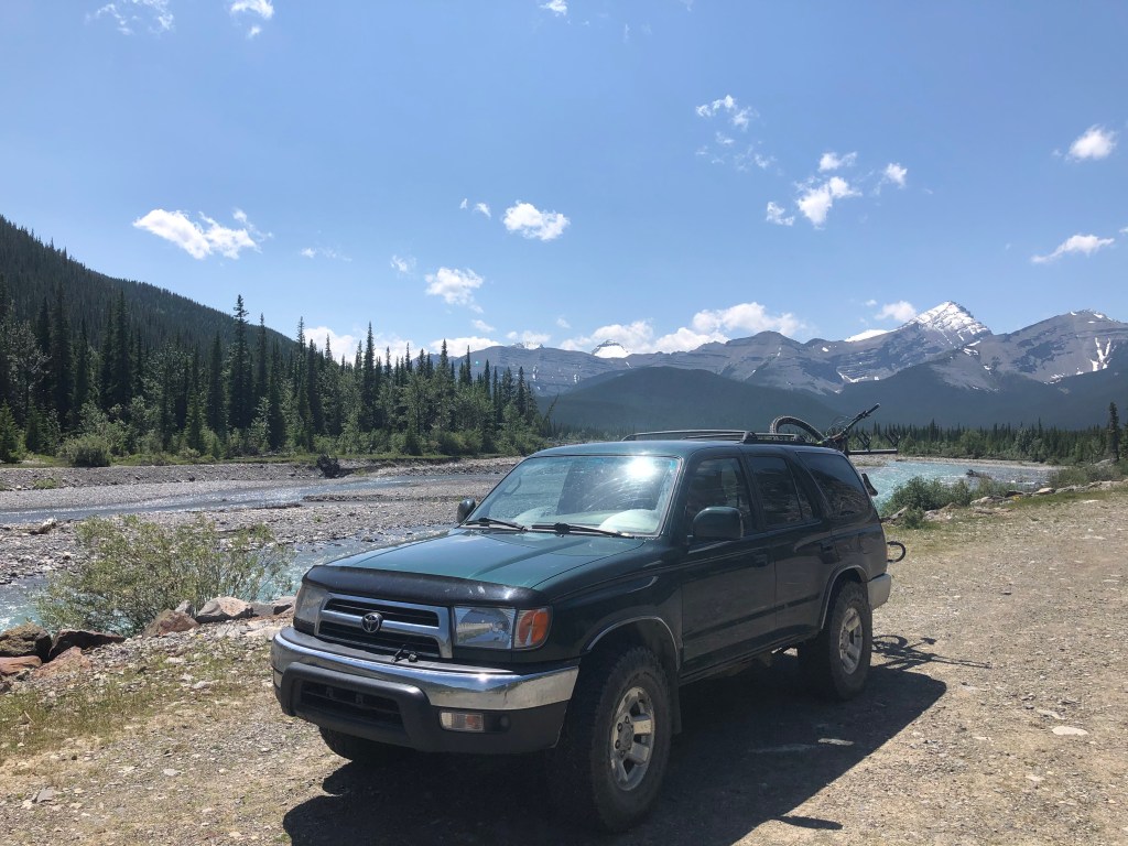 The 4Runner parked at a trailhead in Kananaskis with mountain bikes.